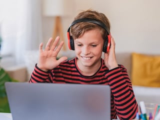 Kid with headphones on participating in therapy