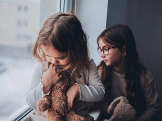 Little kids with anxiety staring out the window