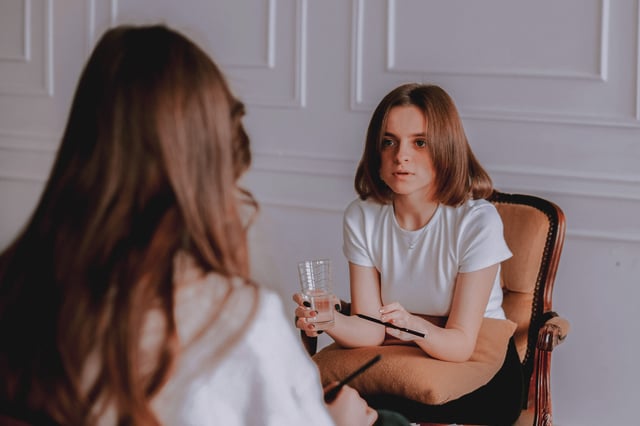 young girl talking during therapy session