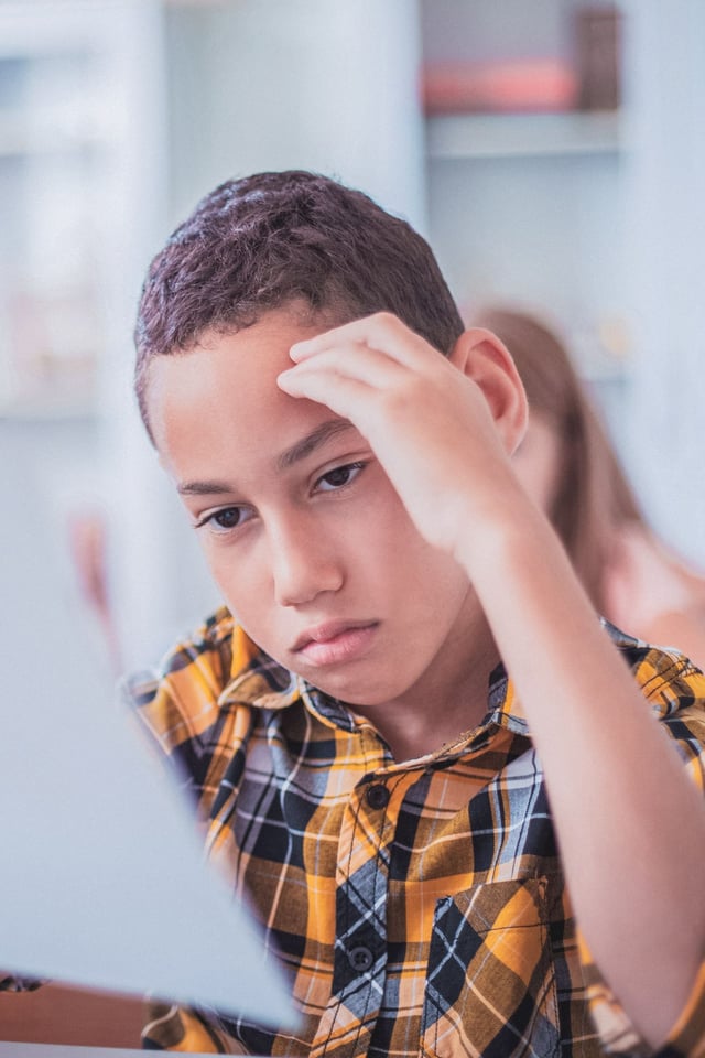 young boy struggling with anxiety at school