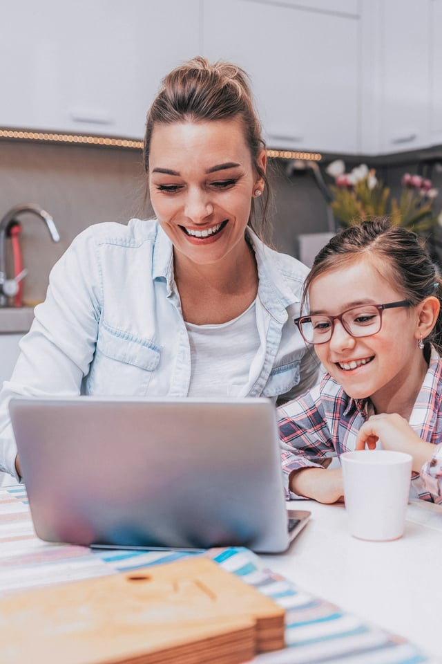 Mom and daughter at the computer together