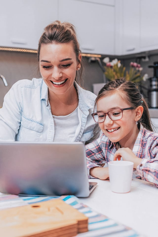 Mom and daughter at the computer together