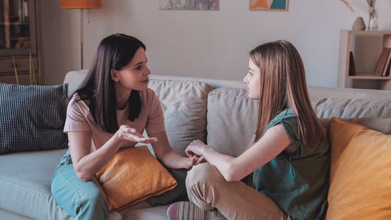 Parent talking to their child about a medication