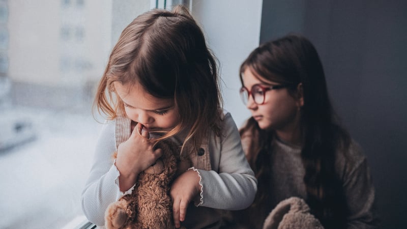 Little kids with anxiety staring out the window