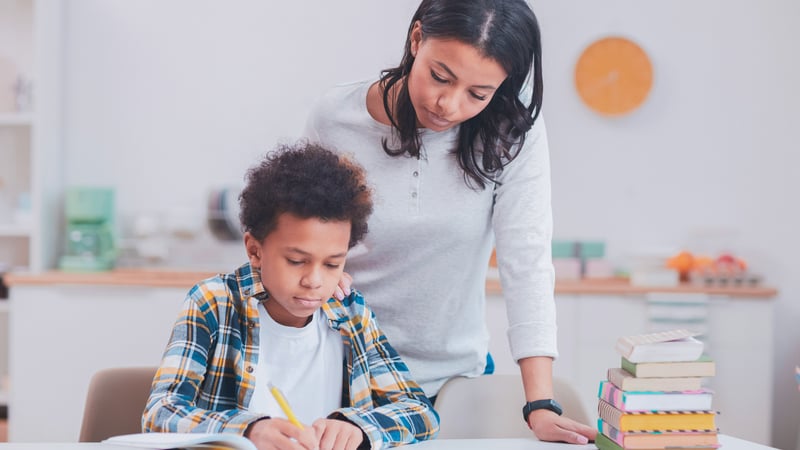 Parent helping her child with schoolwork