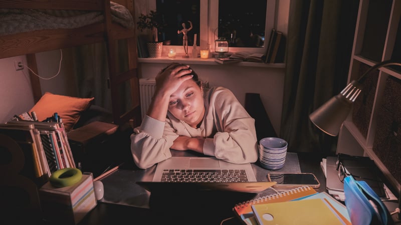 Teen girl struggling with schoolwork
