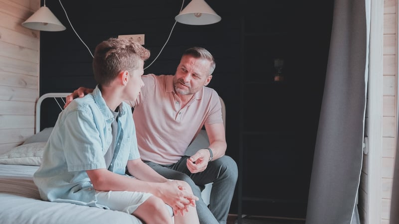 Parent talking to his child about boundaries