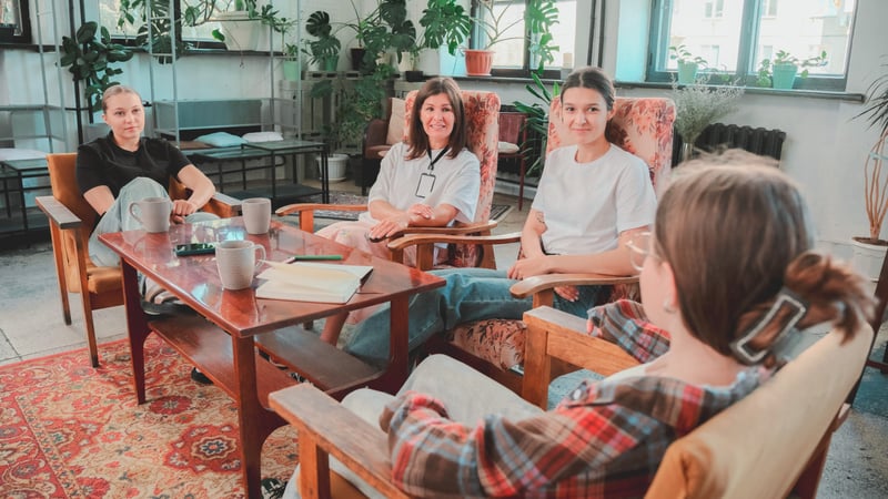 Kids in group therapy session with therapist