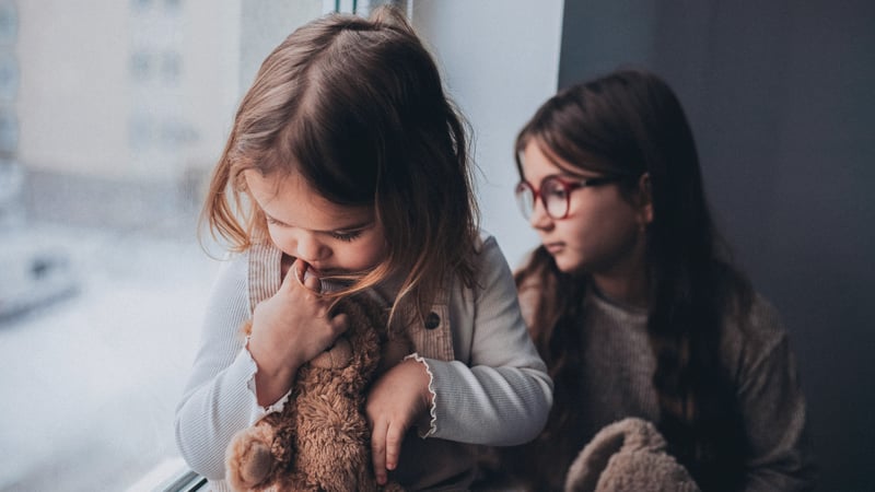 Little kids with anxiety staring out the window