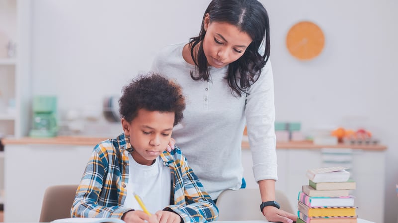 Parent helping her child with schoolwork