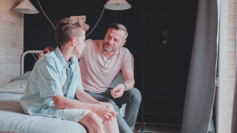 Parent talking to his child about boundaries
