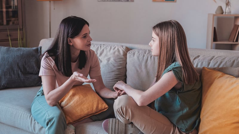 Parent talking to their child about a medication