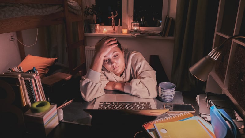 Teen girl struggling with schoolwork