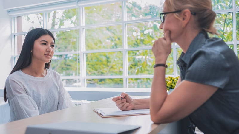 Teen girl talking to school counselor