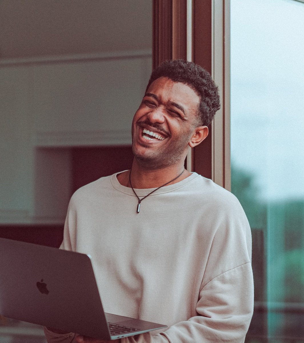 Young adult male laughing
