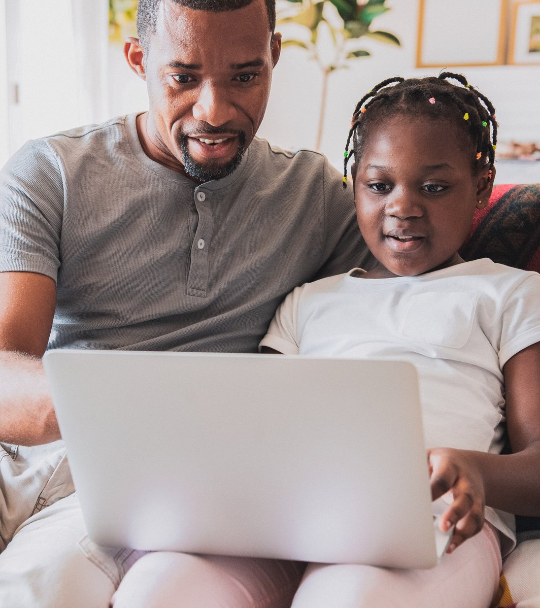 Father and young daughter in virtual therapy session