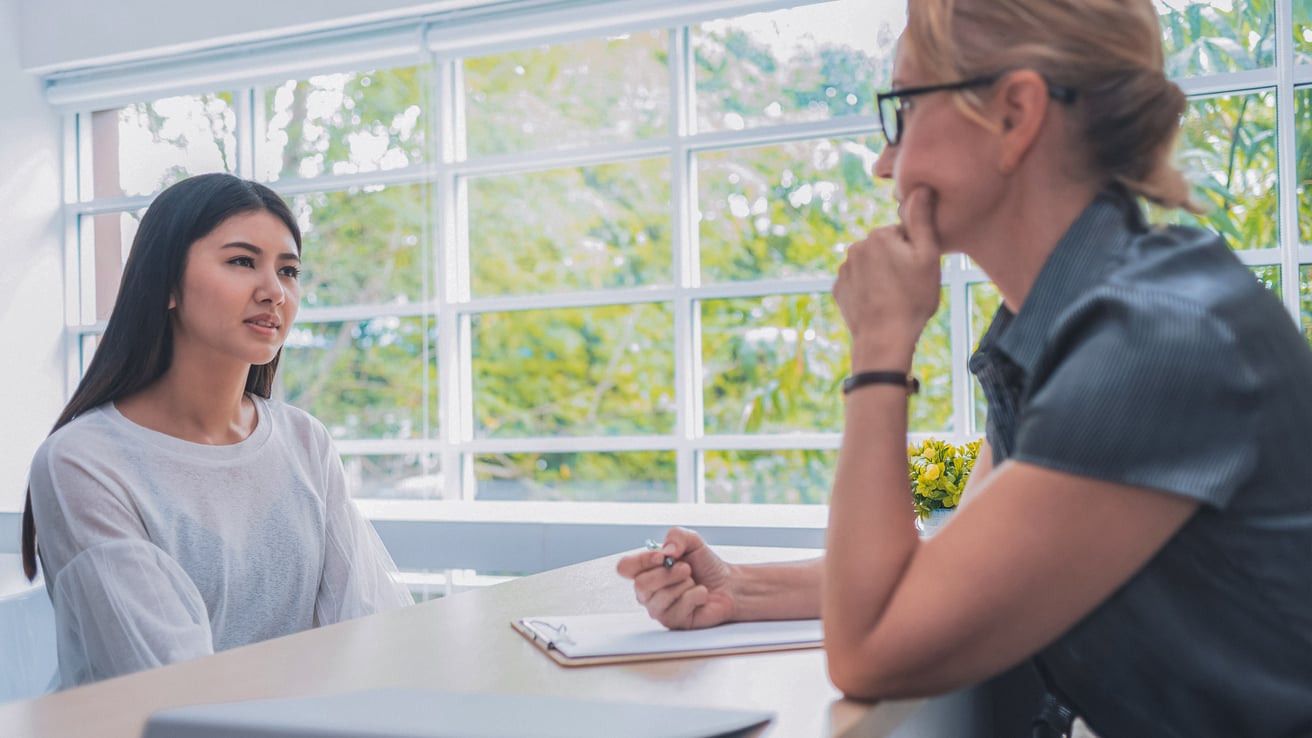 Teen girl talking to school counselor