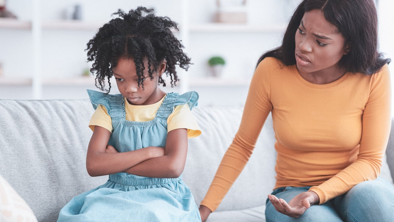Child having a mood swing upset at parent