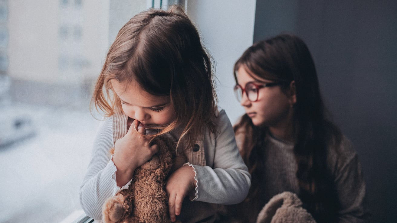 Little kids with anxiety staring out the window