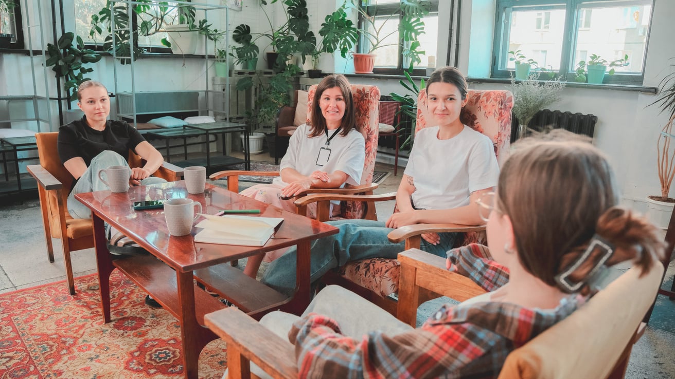Kids in group therapy session with therapist
