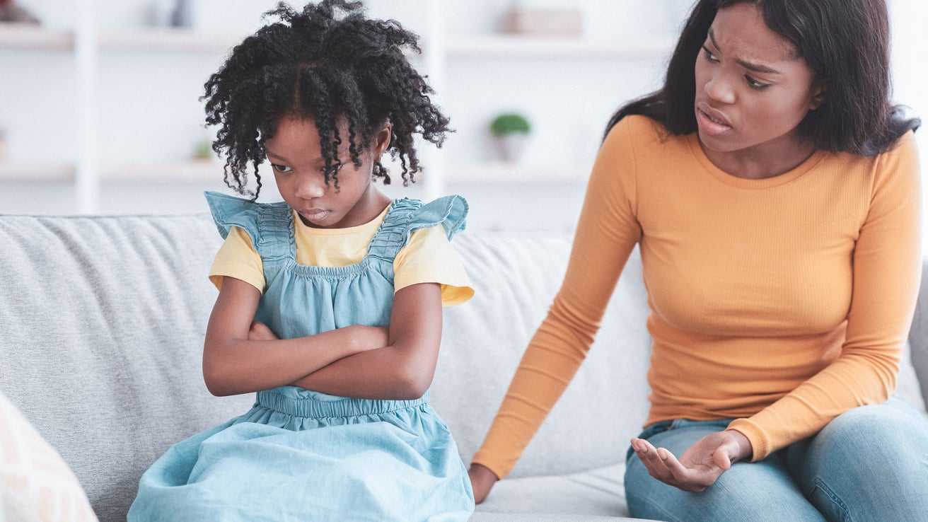 Child having a mood swing upset at parent