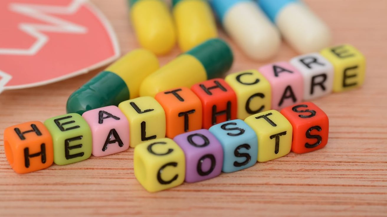 Healthcare costs spelled out on different colored blocks