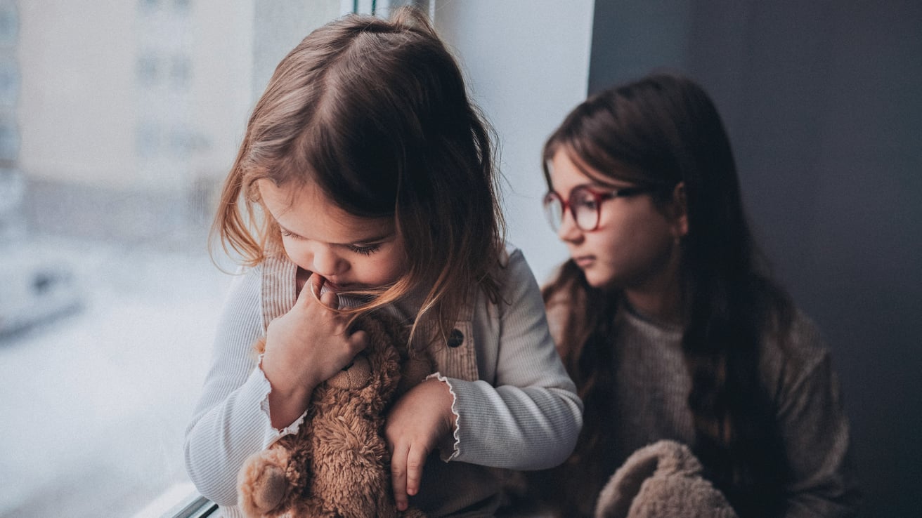 Little kids with anxiety staring out the window