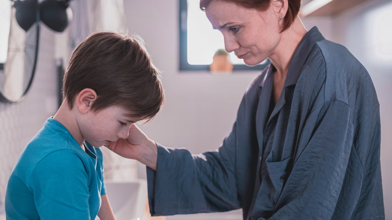 Mom comforting son dealing with the loss of a family member