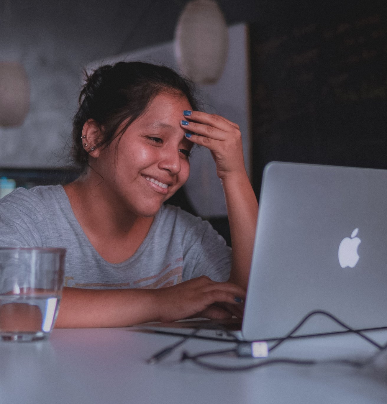 teen girl smiling during her online therapy session
