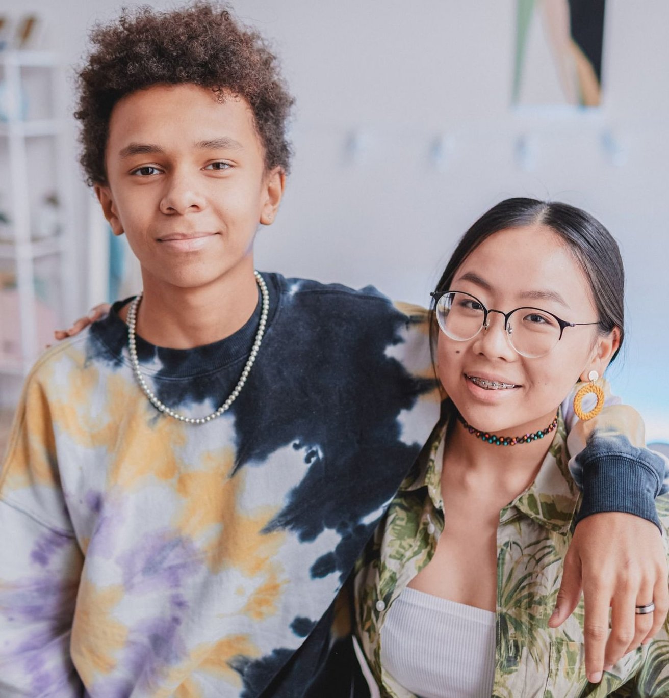Teen boy and girl looking at the camera