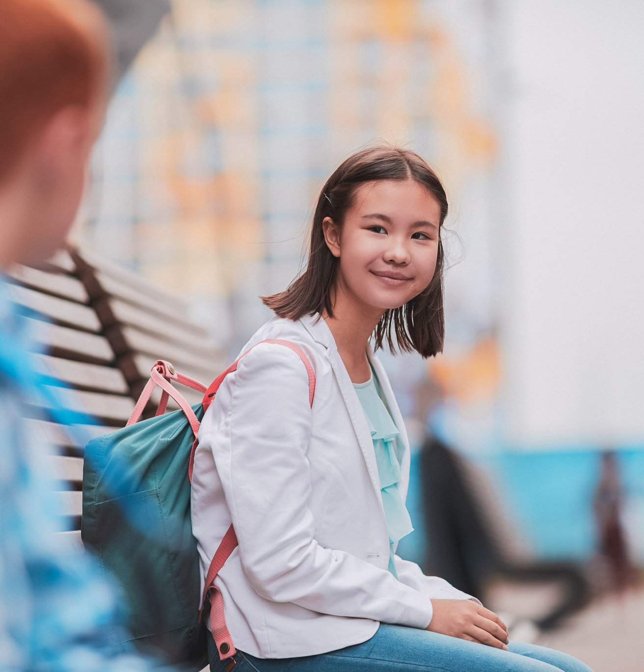 young girl smiling outside school