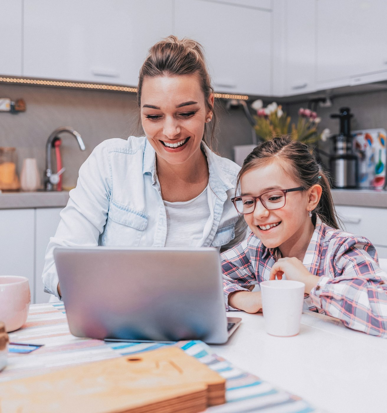 Mom and daughter at the computer together