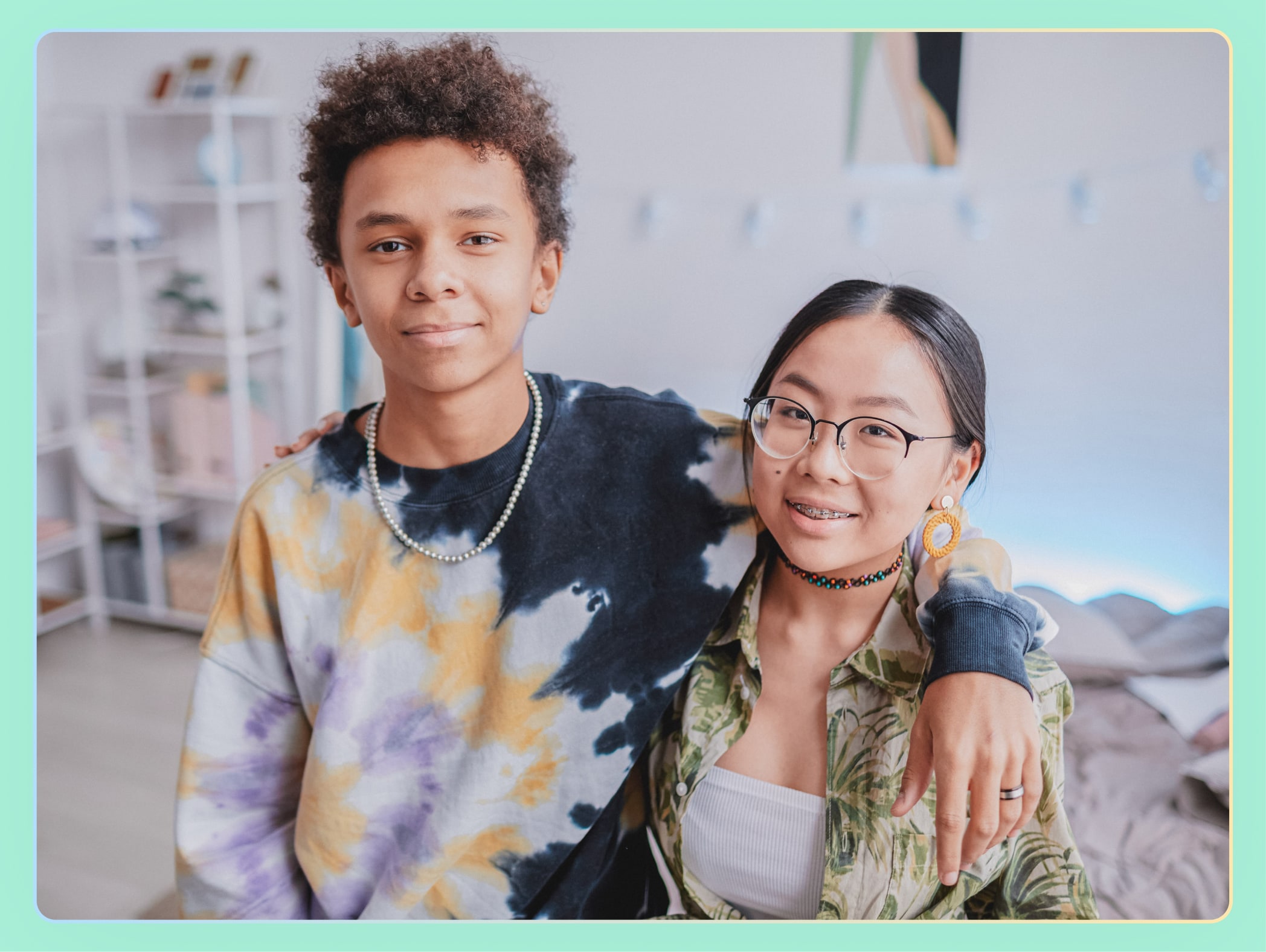 Teen boy and girl looking at the camera
