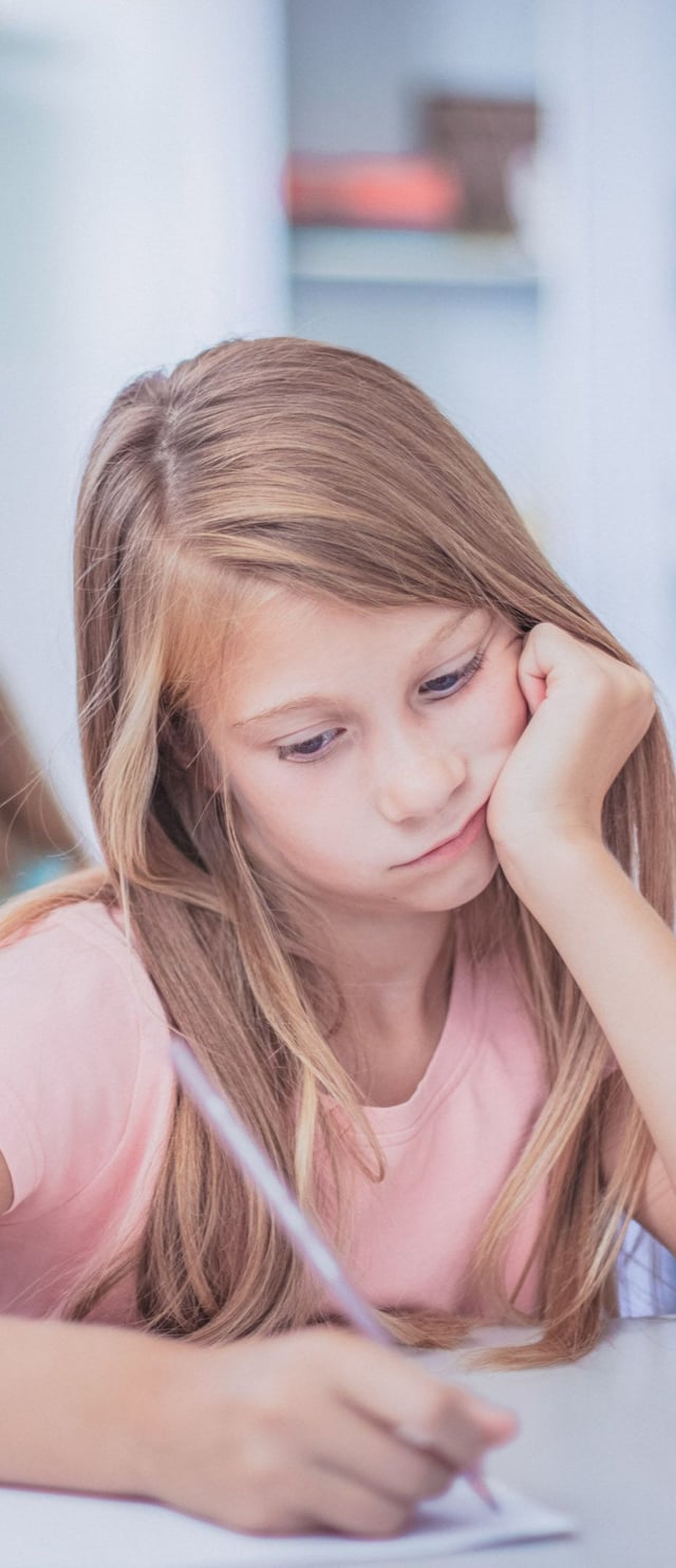young girl sad at school