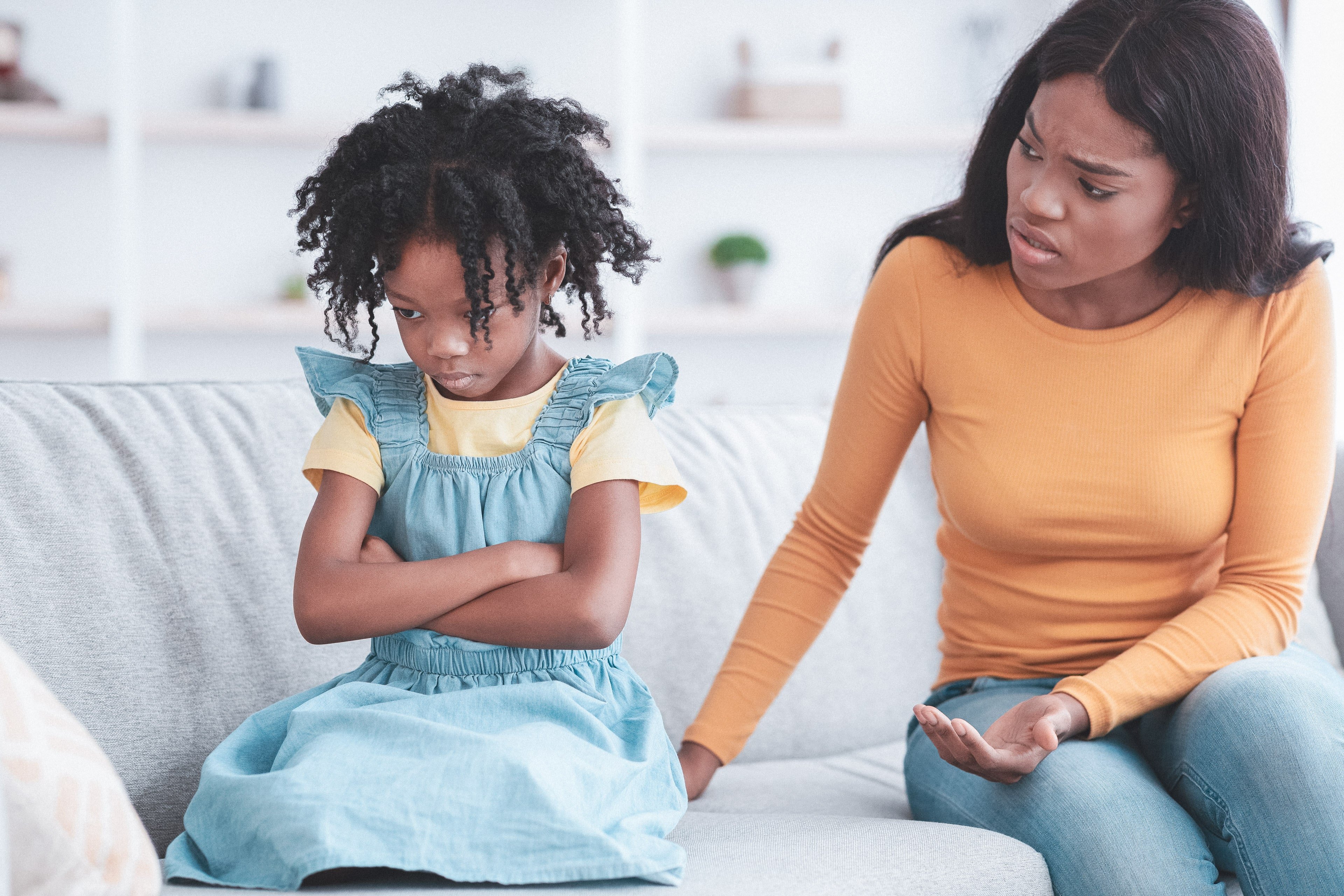 Child having a mood swing upset at parent