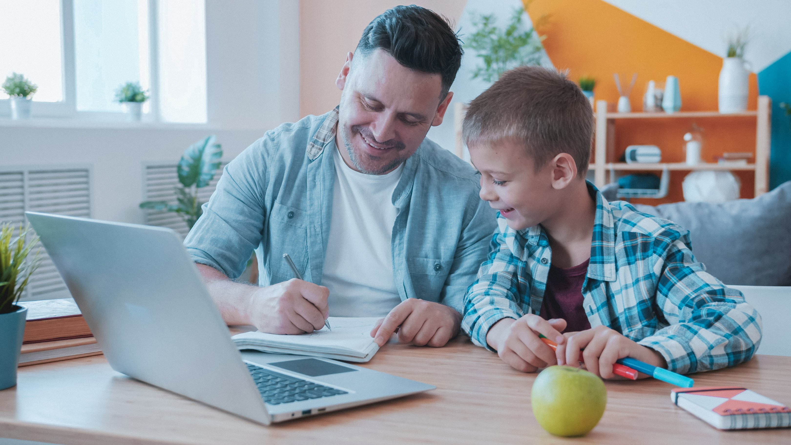 Dad and son doing homework together