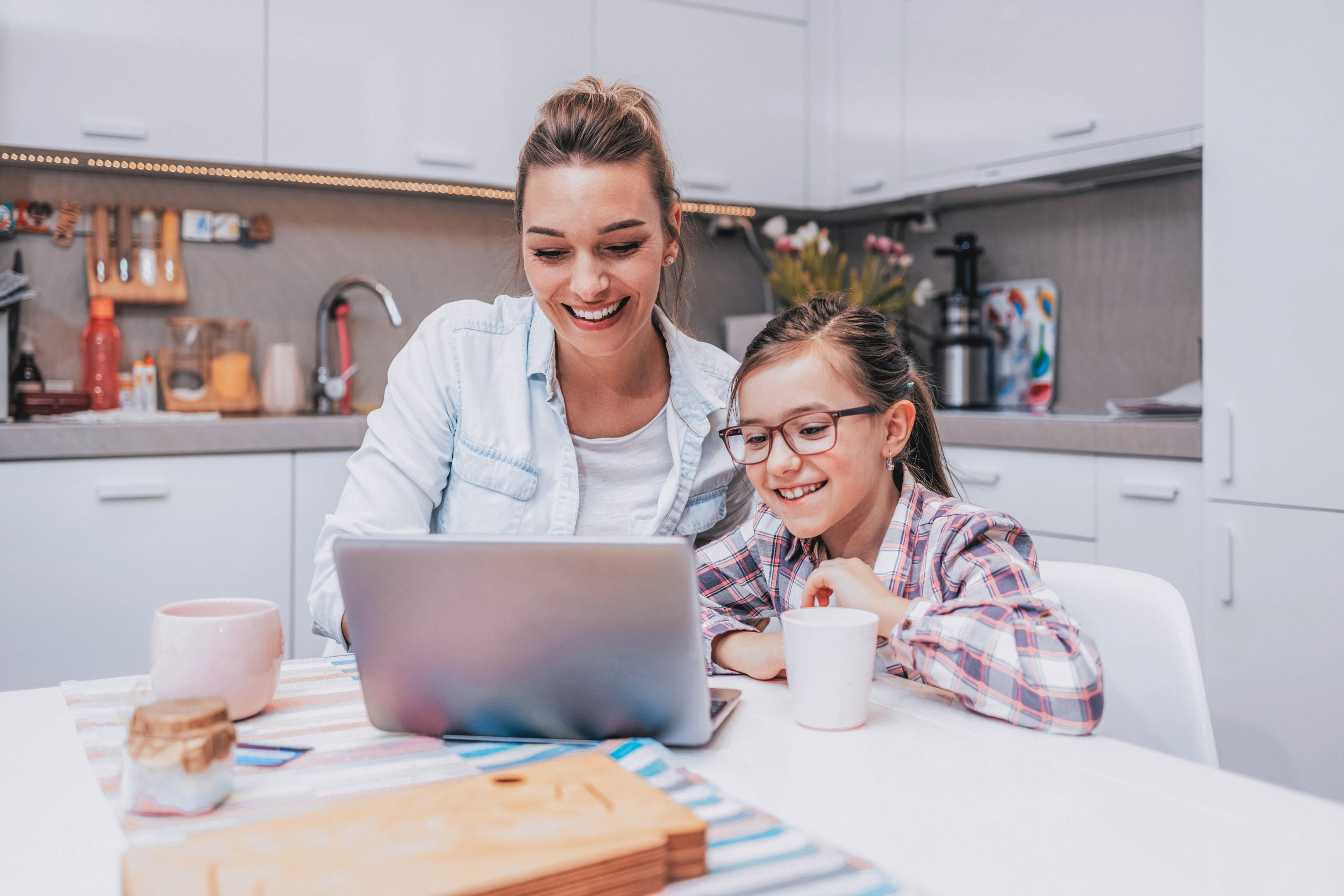 Mom and daughter at the computer together