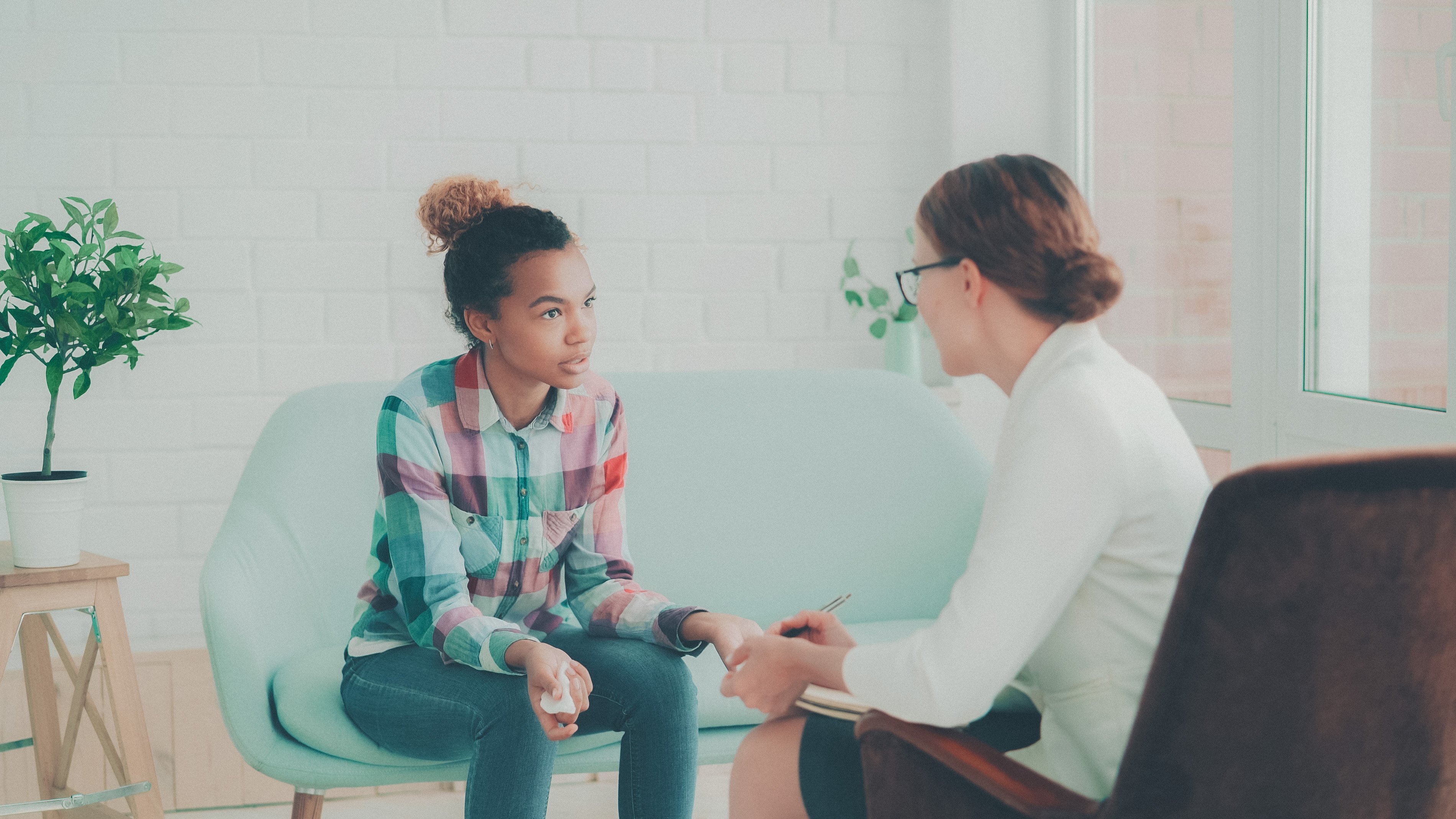 Kids in individual therapy session chatting with therapist