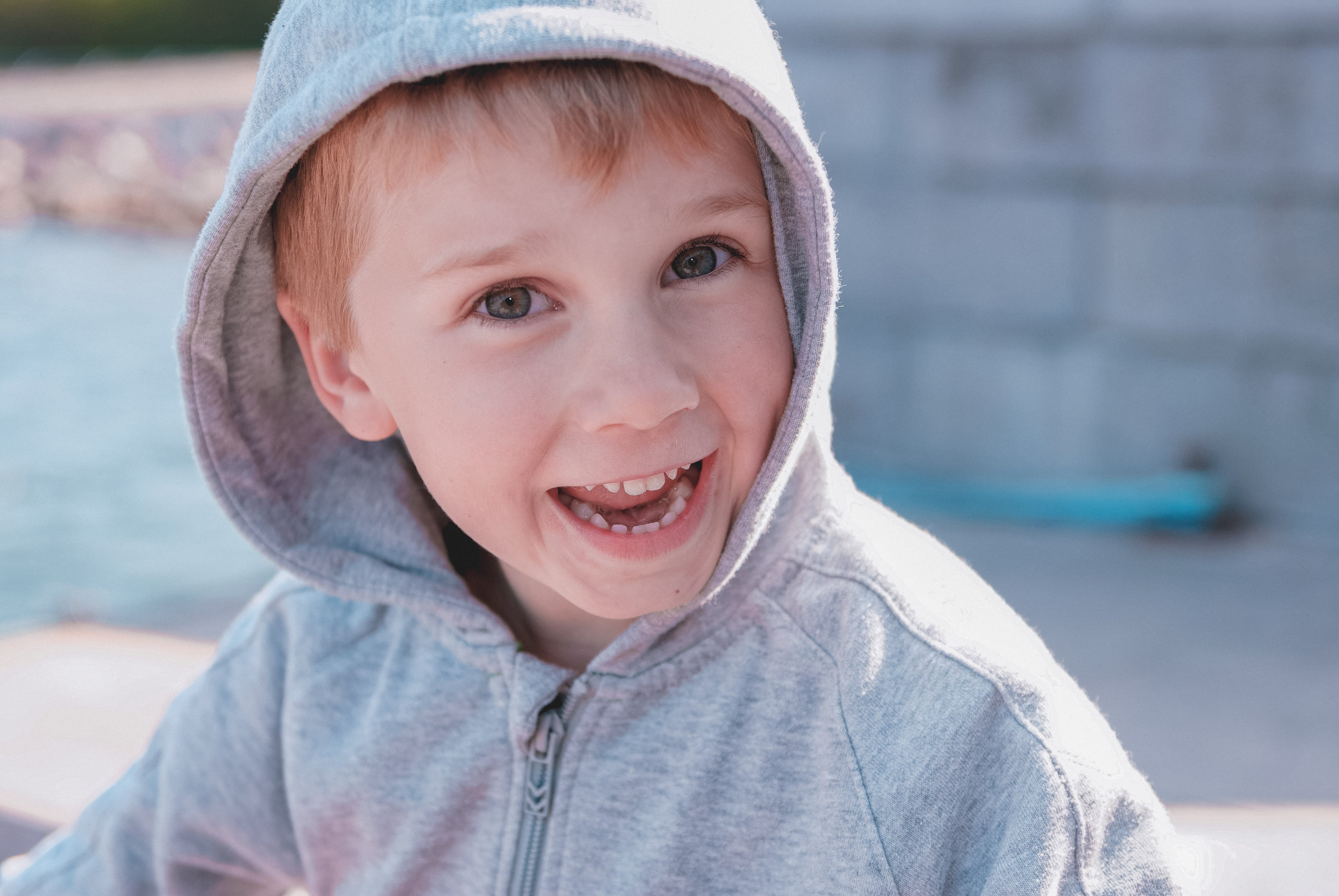 Kid in a hoodie with ADHD smiling