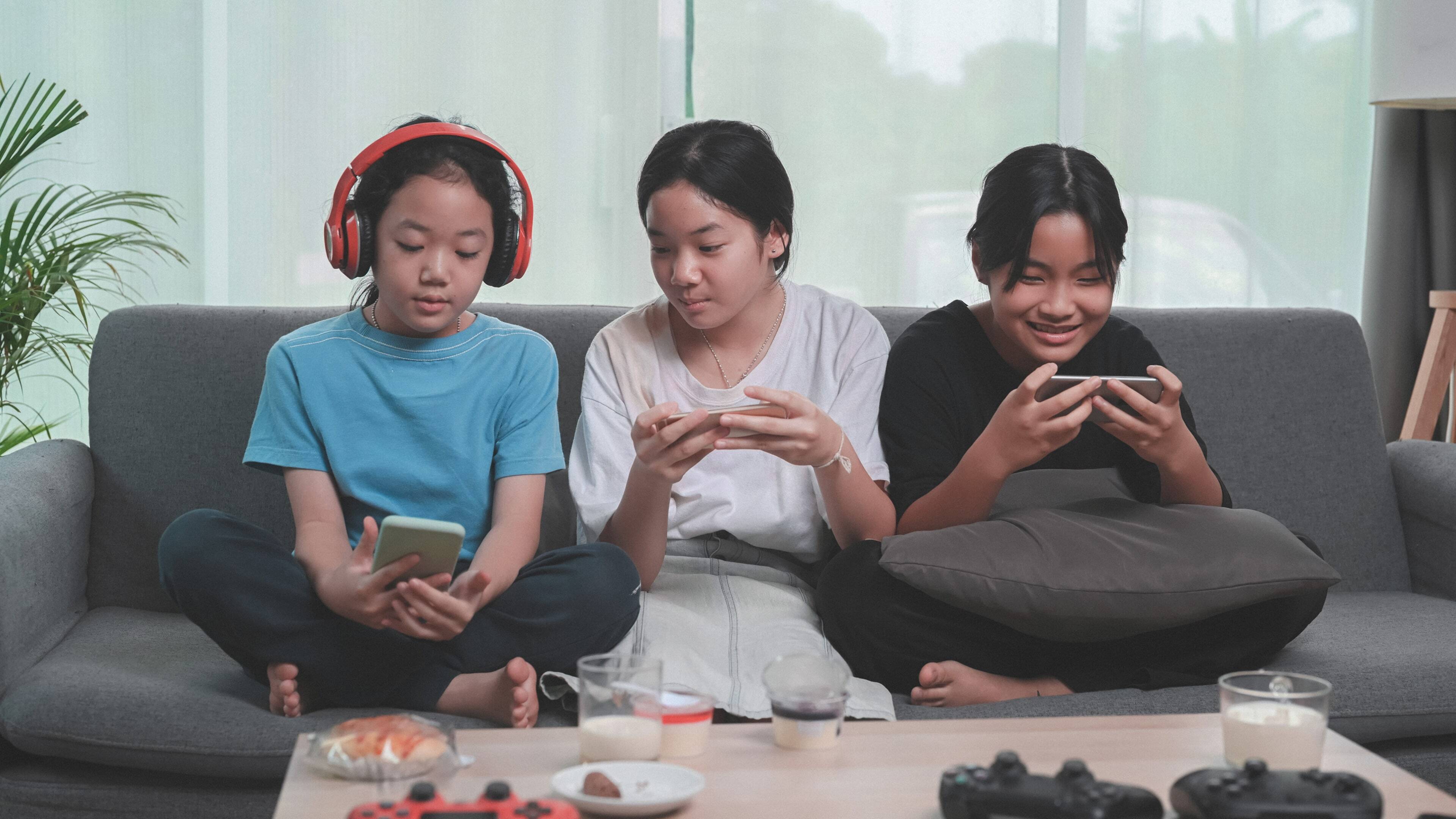 Kids playing on their phones