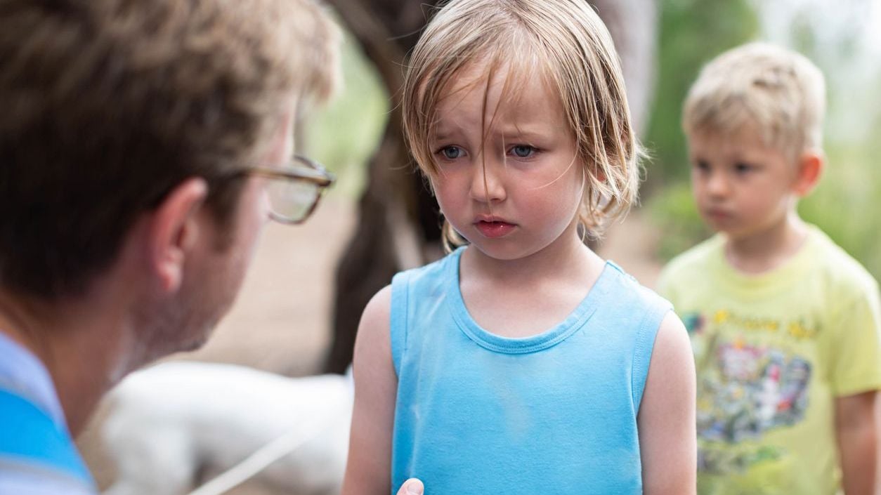 Parent discipling child with adhd