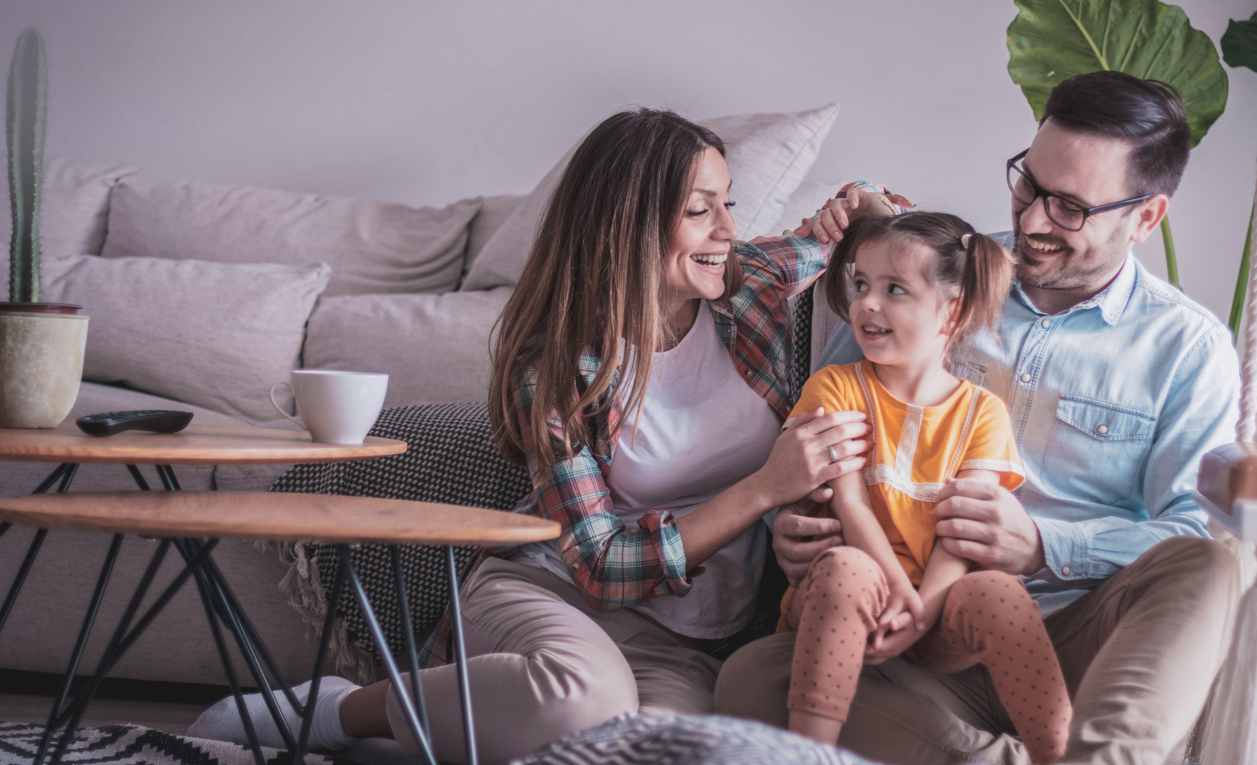 Parents sitting with autistic daughter