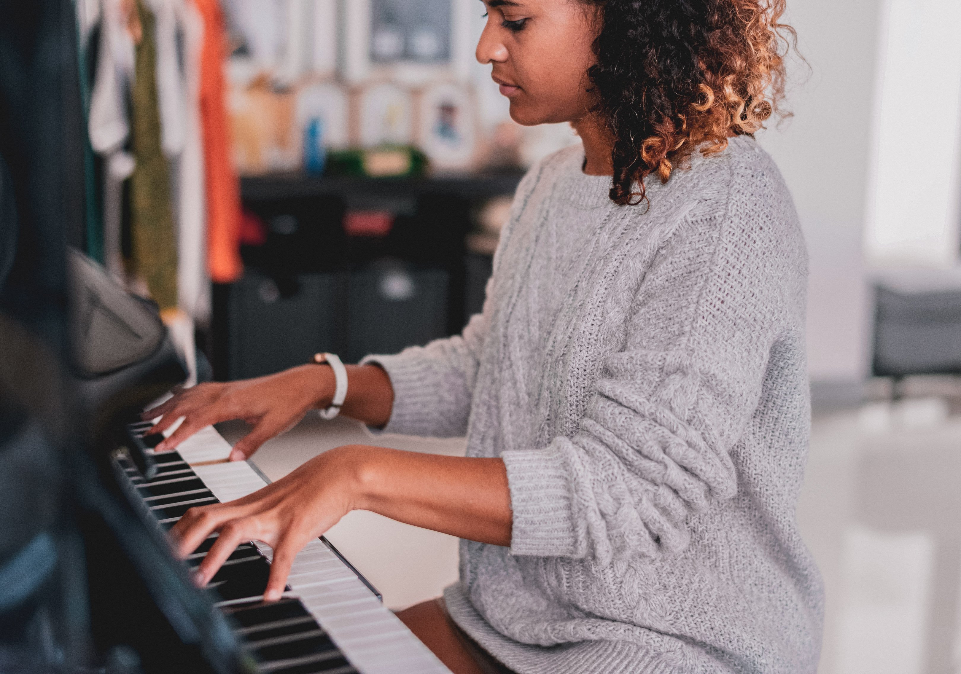 Teen girl practicing piano