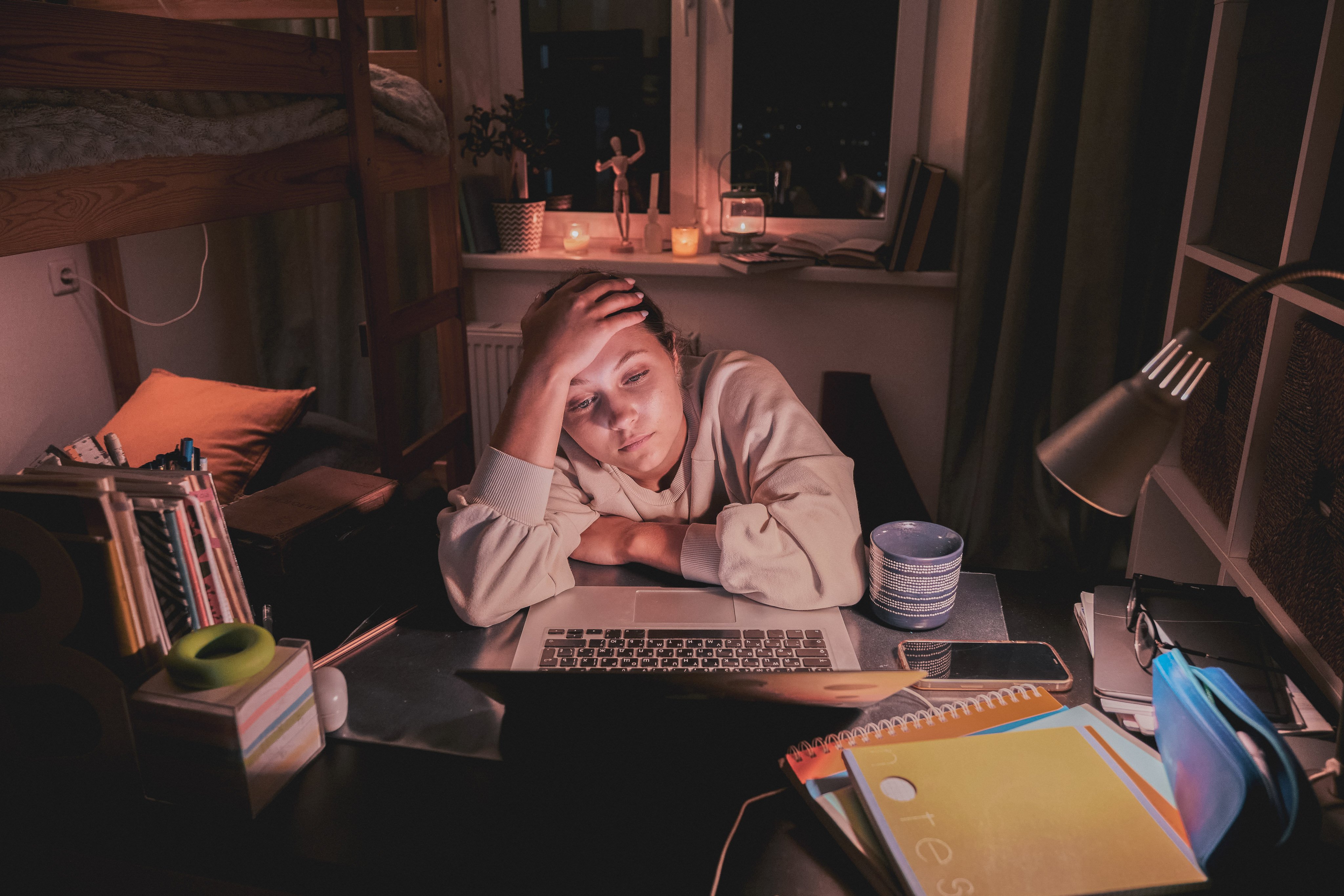 Teen girl struggling with schoolwork