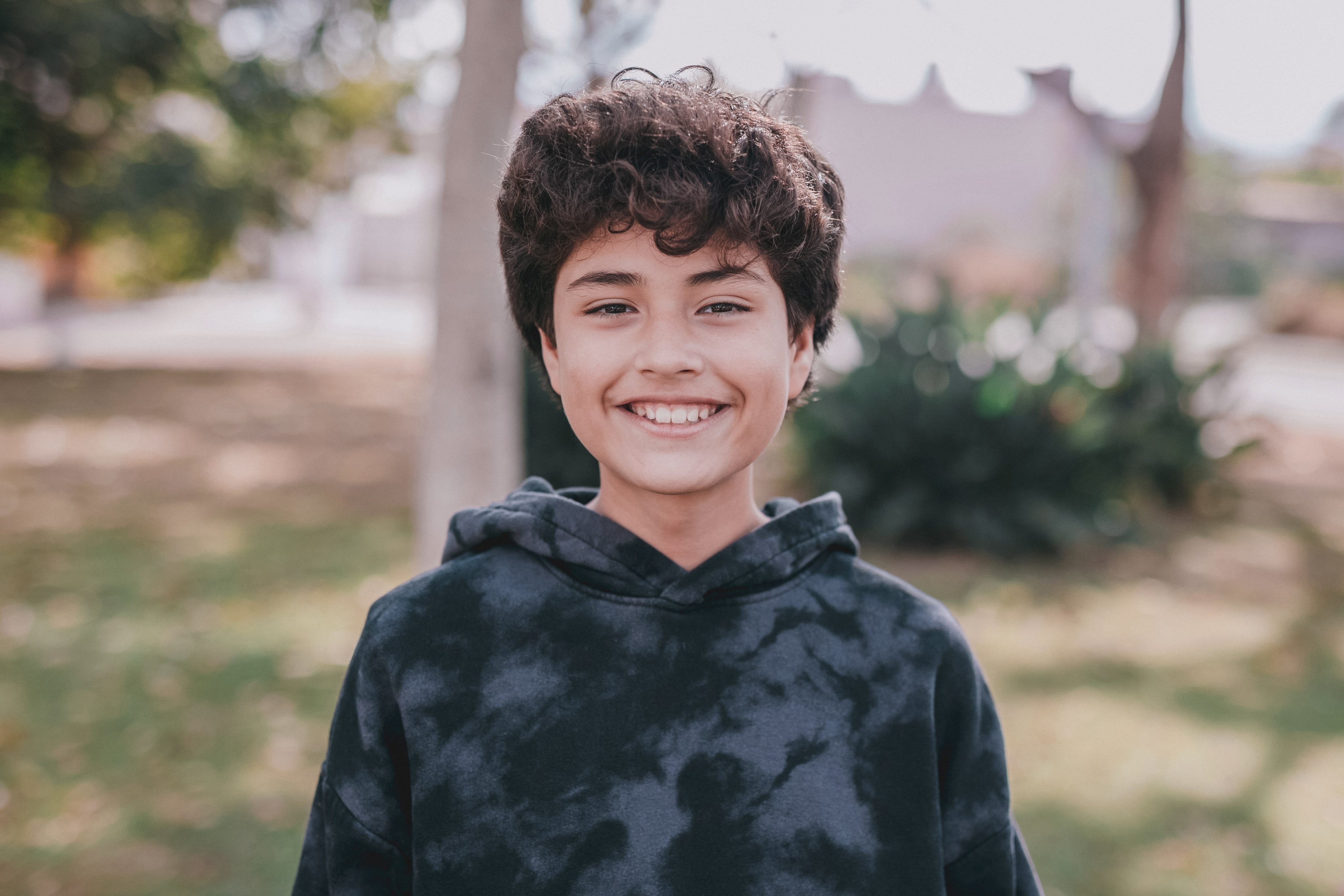 Teen smiling outside