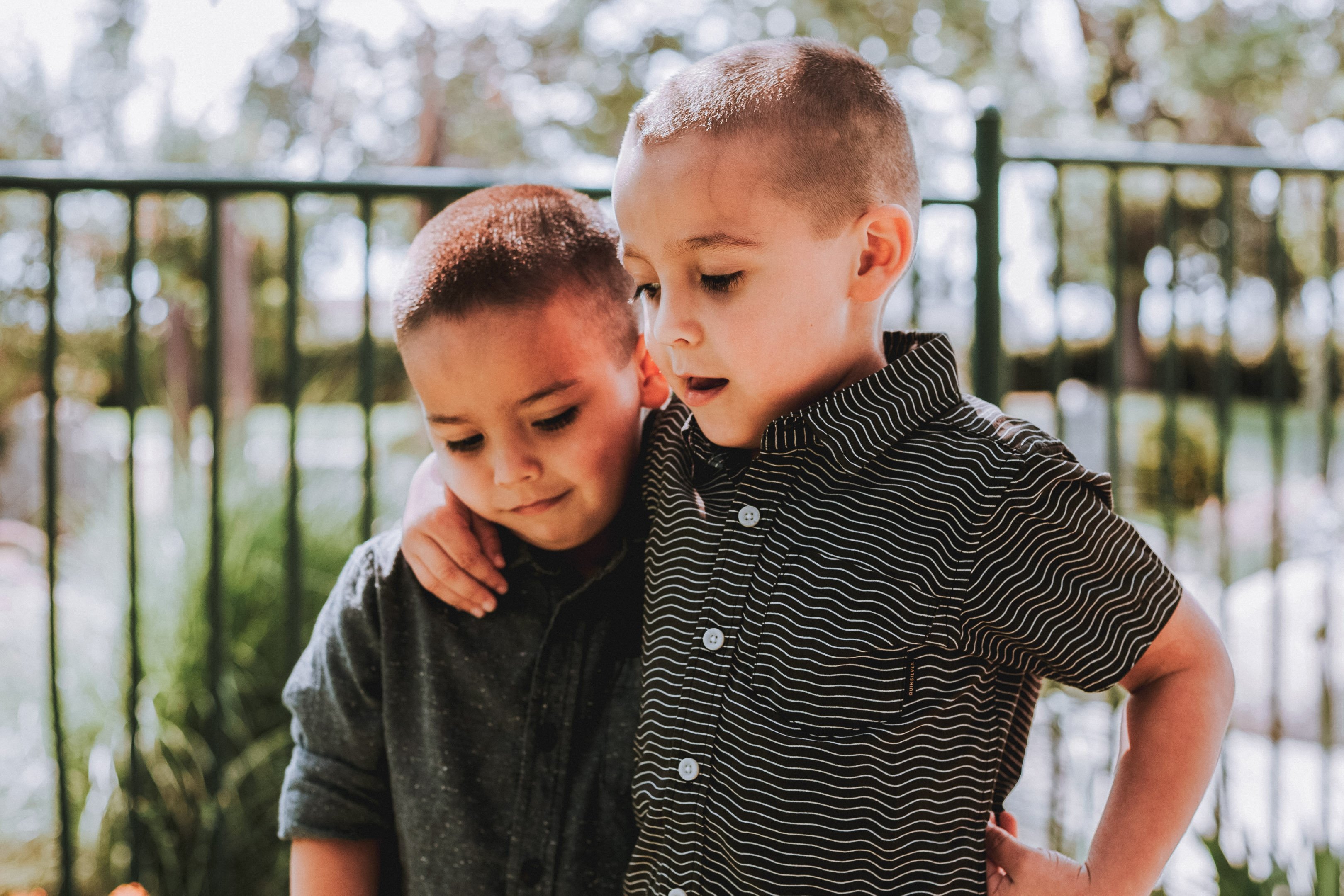 Two little boys hugging each other