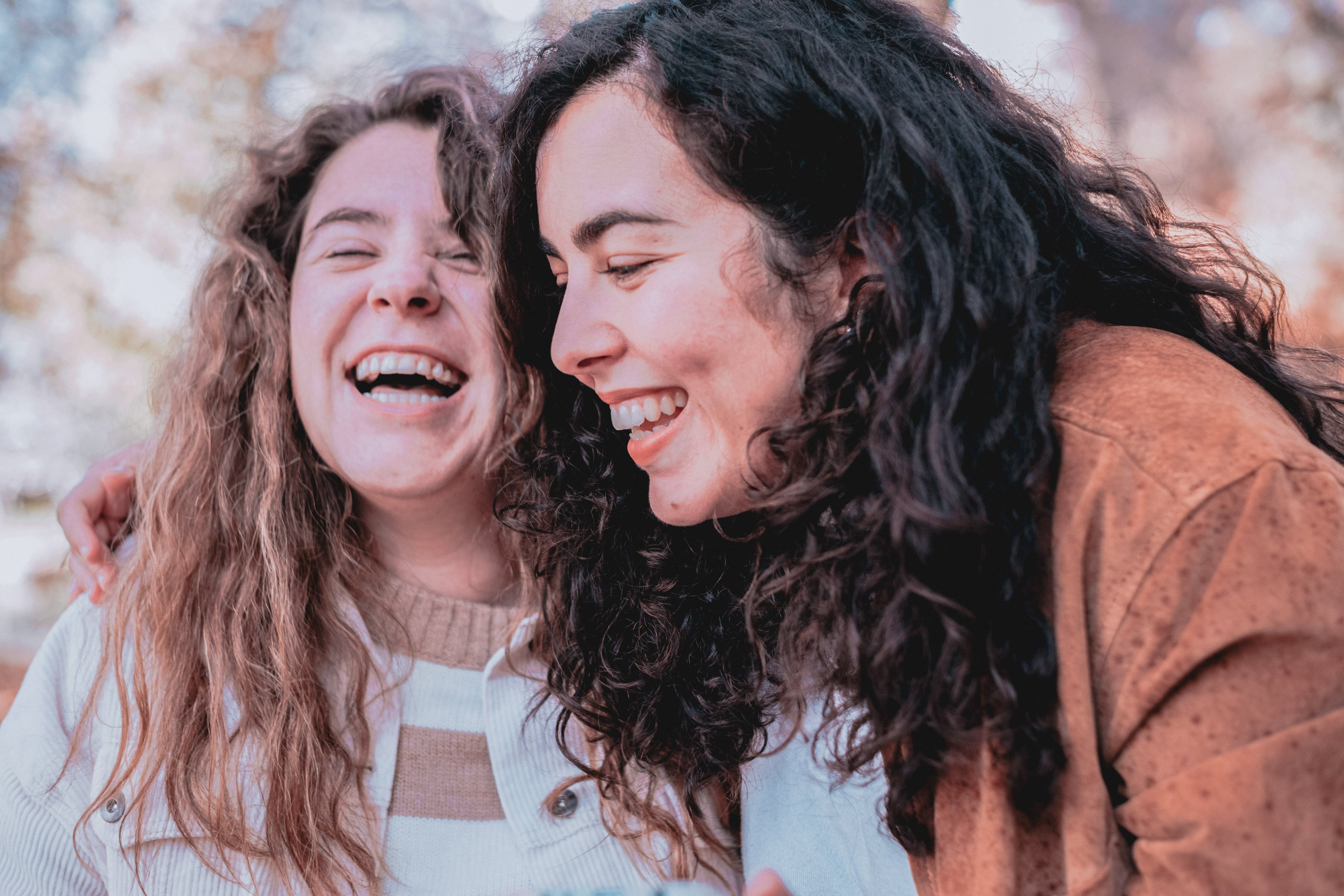 Two teens laughing and smiling