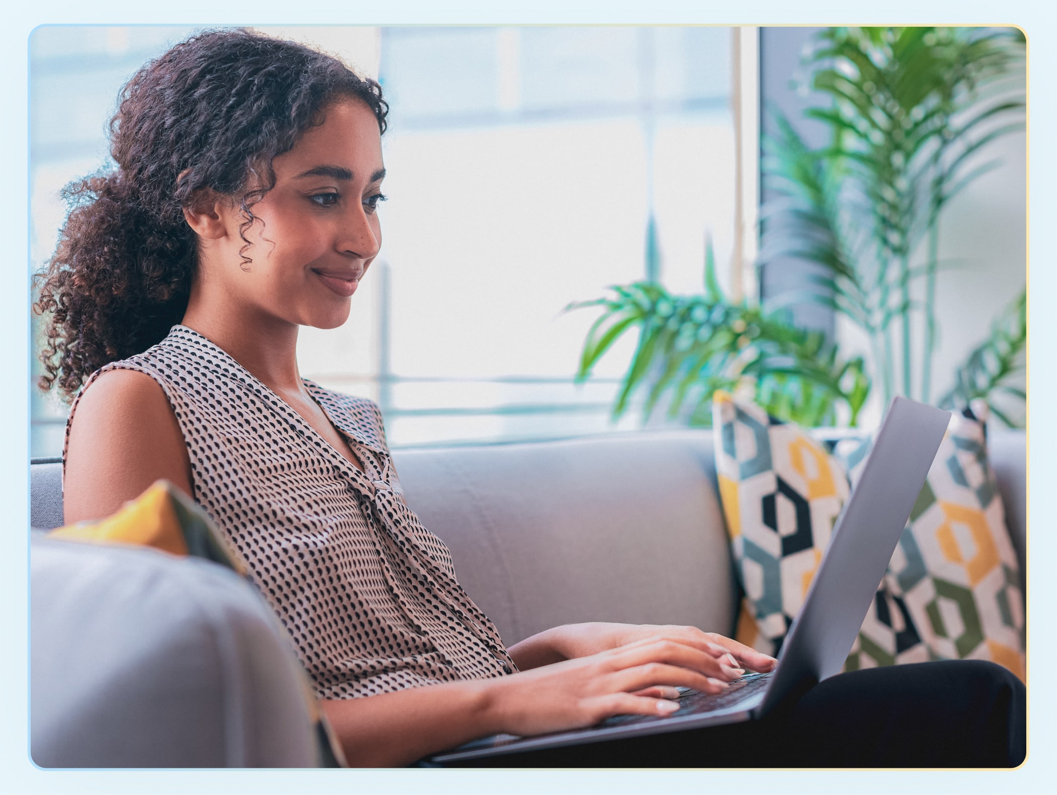 young girl on her laptop in her bedroom