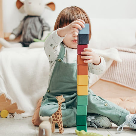 kid playing with blocks