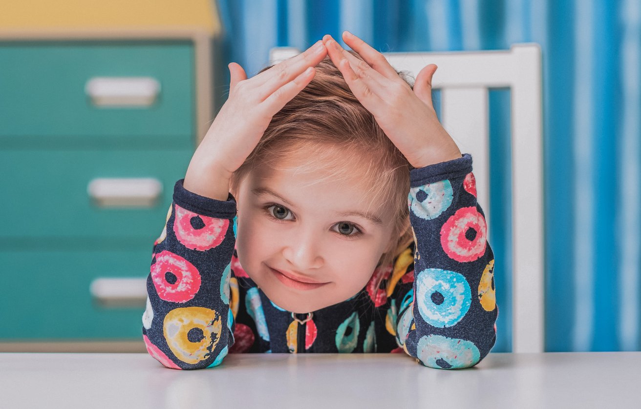 A young child looking at the camera